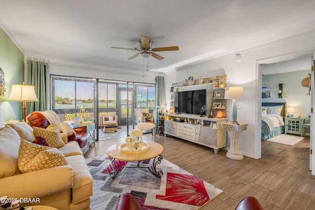 456 Bouchelle Dr Unit 104, New Smyrna Beach, FL 32169 - living room with ornamental molding, a ceiling fan, and wood finished floors