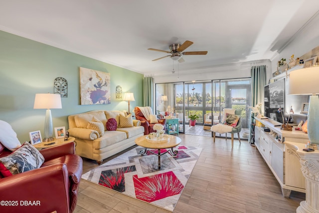 456 Bouchelle Dr Unit 104, New Smyrna Beach, FL 32169 - living area featuring wood finished floors, ceiling fan, and crown molding