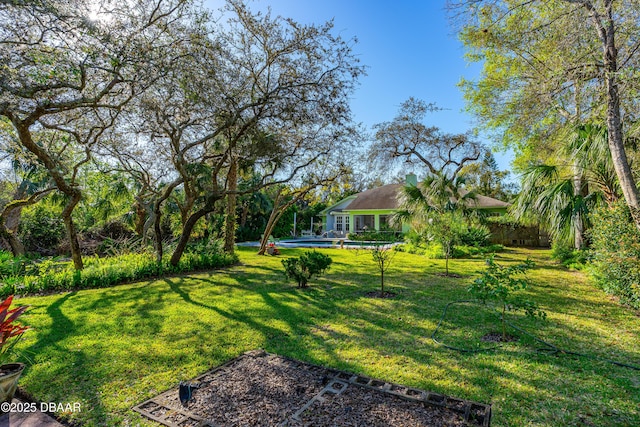 view of yard with an outdoor pool