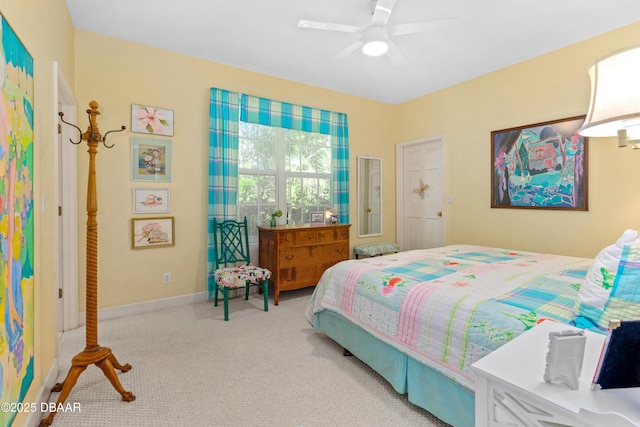 bedroom with carpet flooring, a ceiling fan, and baseboards