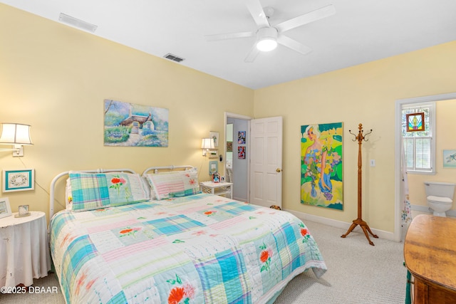 carpeted bedroom with visible vents, ceiling fan, and baseboards