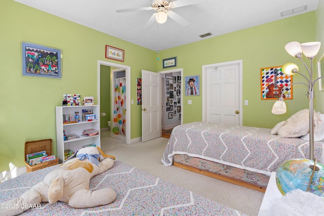 bedroom featuring visible vents, baseboards, a ceiling fan, and carpet floors