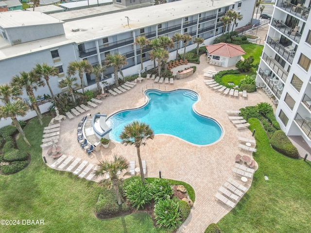 view of swimming pool with a patio