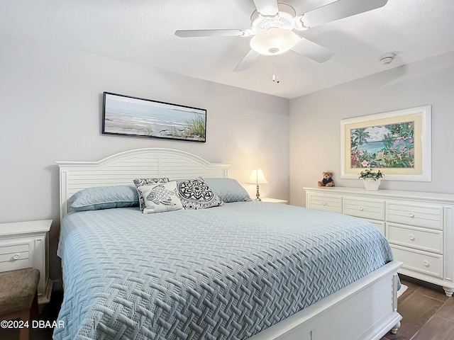 bedroom featuring ceiling fan and dark hardwood / wood-style floors