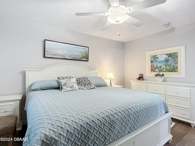 2425 S Atlantic Ave Unit 1004, Daytona Beach Shores, FL 32118 - bedroom with dark wood-style floors and ceiling fan