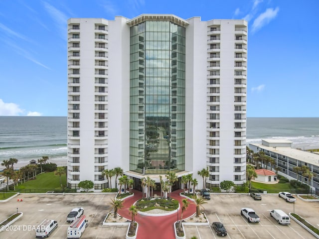 2425 S Atlantic Ave Unit 1004, Daytona Beach Shores, FL 32118 - view of apartment building / complex featuring uncovered parking and a water view