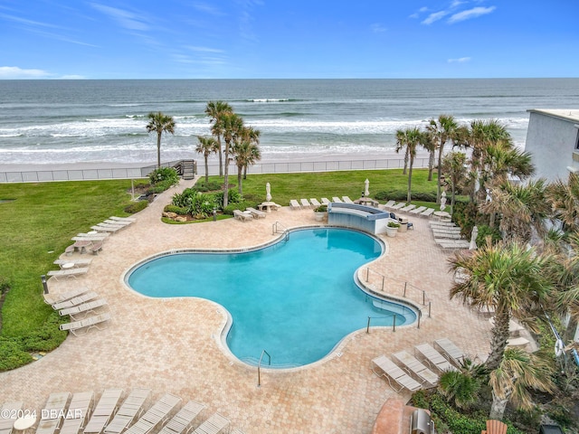 2425 S Atlantic Ave Unit 1004, Daytona Beach Shores, FL 32118 - community pool featuring view of water and beach and a patio