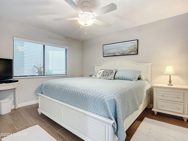 bedroom featuring ceiling fan and dark hardwood / wood-style flooring