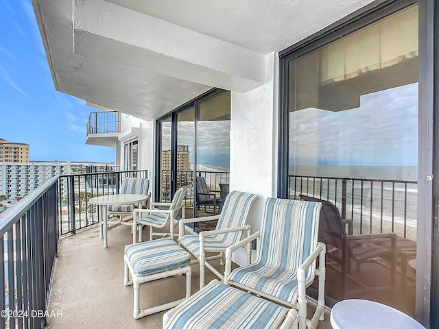 balcony featuring a water view