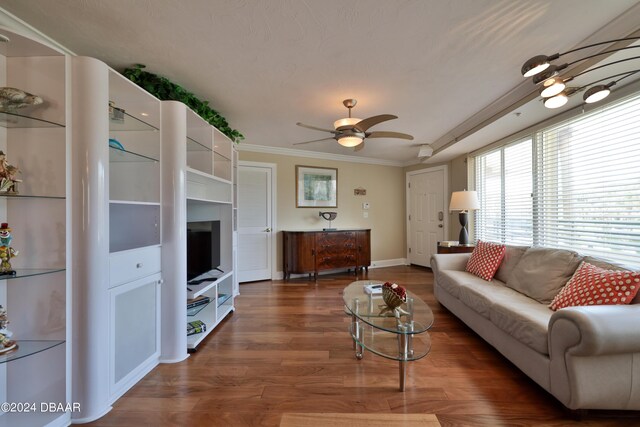 4631 S Atlantic Ave Unit 8101, Ponce Inlet, FL 32127 - living room with crown molding, a ceiling fan, wood finished floors, and baseboards