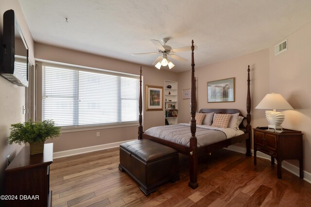 4631 S Atlantic Ave Unit 8101, Ponce Inlet, FL 32127 - bedroom with baseboards and wood finished floors