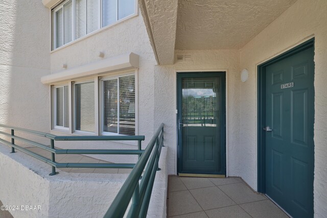 4631 S Atlantic Ave Unit 8101, Ponce Inlet, FL 32127 - property entrance featuring stucco siding and a balcony