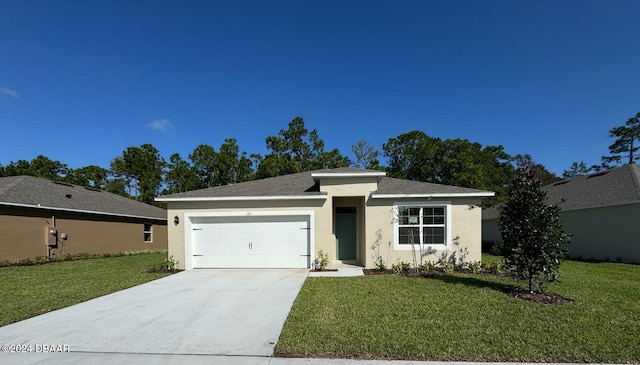 view of front of house with a front yard and a garage