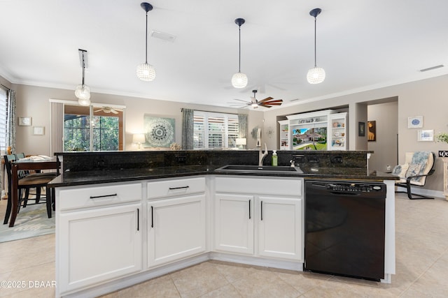 kitchen featuring decorative light fixtures, dishwasher, a kitchen island, and white cabinets