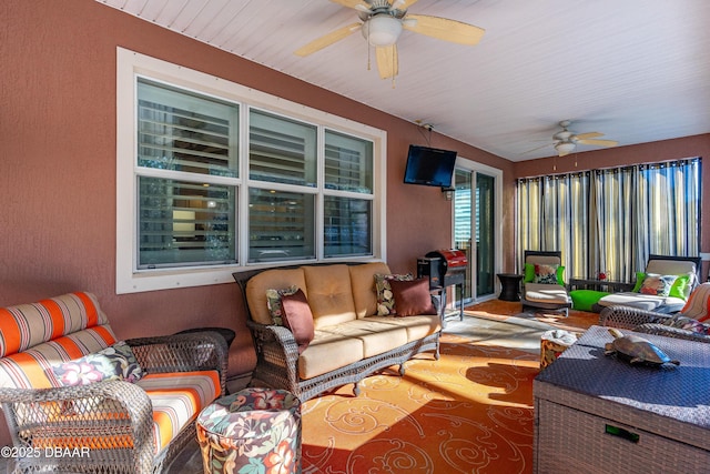 sunroom / solarium with ceiling fan