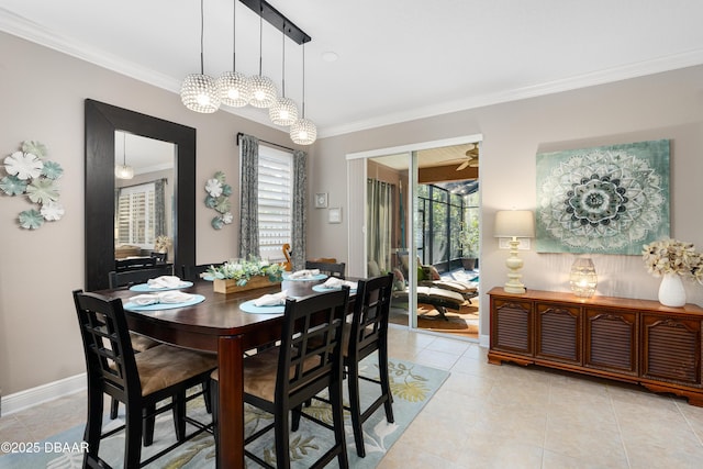 dining space featuring crown molding, ceiling fan, and light tile patterned floors