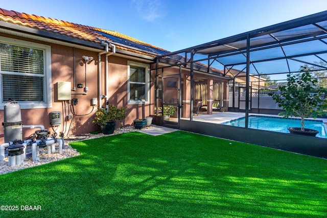 view of yard with a patio and glass enclosure