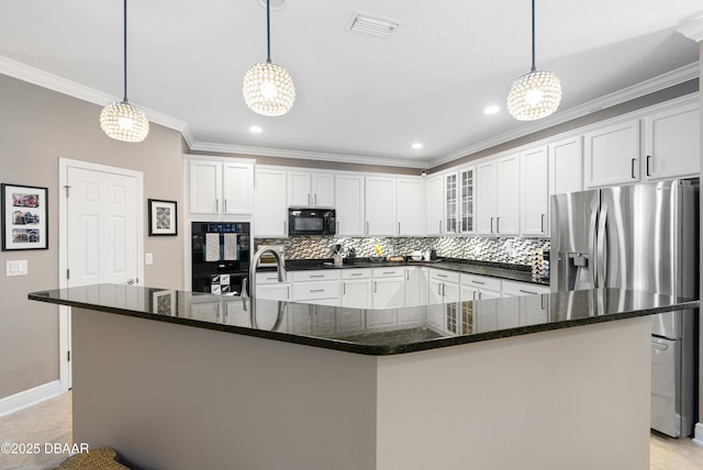 kitchen featuring pendant lighting, black appliances, and a spacious island