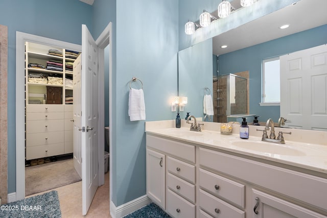 bathroom with vanity and a shower with shower door