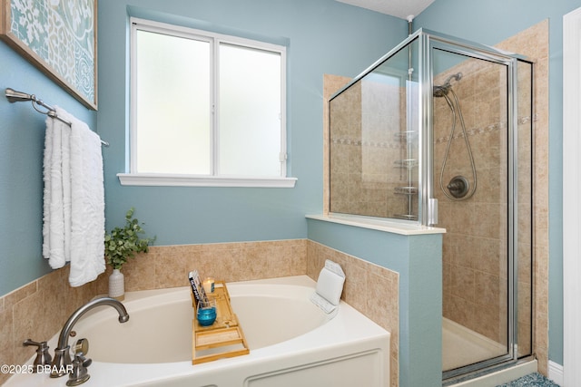 bathroom with shower with separate bathtub