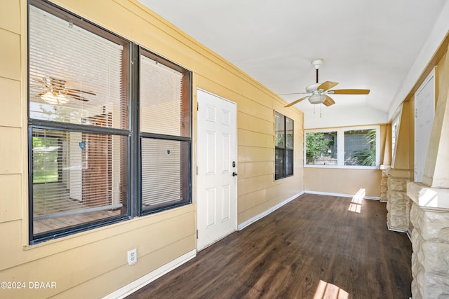 interior space featuring dark hardwood / wood-style flooring and vaulted ceiling