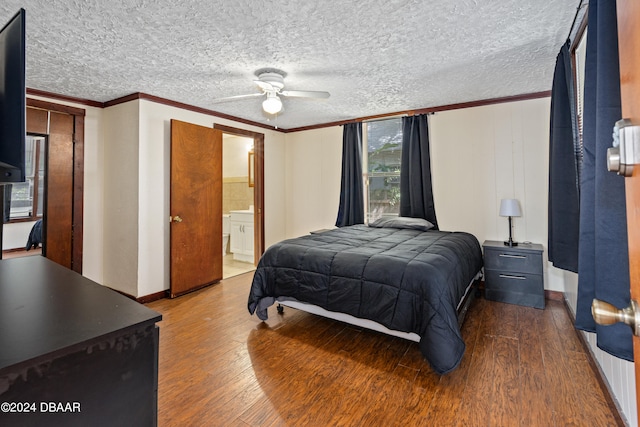 bedroom with ensuite bath, hardwood / wood-style flooring, ceiling fan, and crown molding