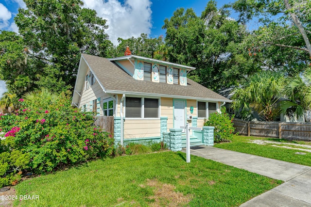 bungalow with a front lawn