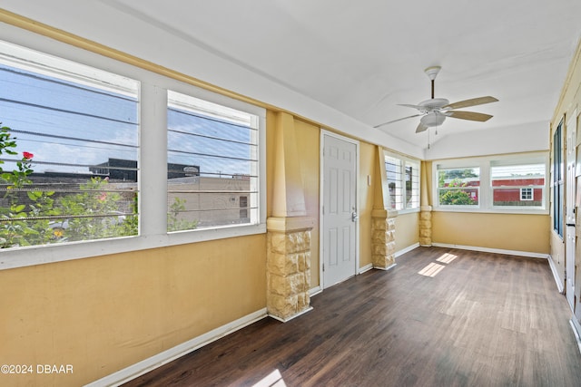 unfurnished sunroom featuring ceiling fan