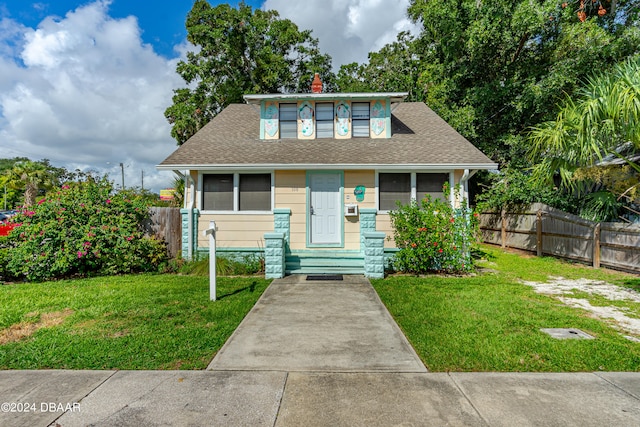 bungalow with a front yard