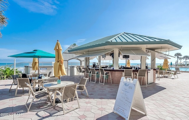 2700 N Atlantic Ave Unit 905, Daytona Beach, FL 32118 - view of patio featuring a water view and a gazebo
