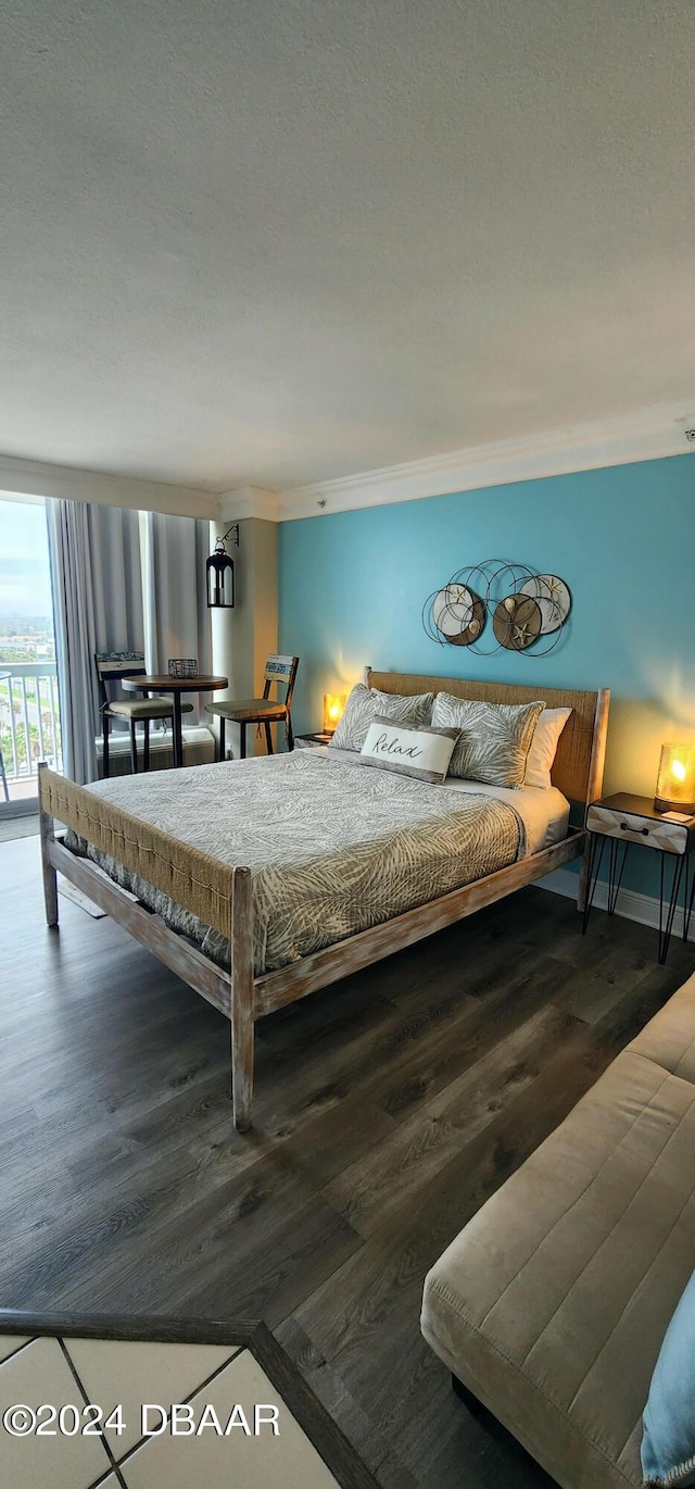 2700 N Atlantic Ave Unit 905, Daytona Beach, FL 32118 - bedroom featuring wood finished floors and ornamental molding