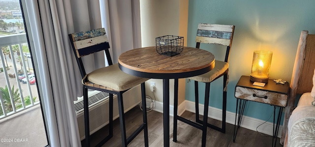 2700 N Atlantic Ave Unit 905, Daytona Beach, FL 32118 - dining room with wood finished floors and baseboards