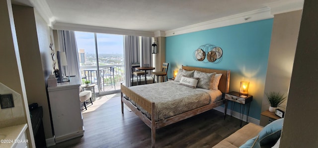 2700 N Atlantic Ave Unit 905, Daytona Beach, FL 32118 - bedroom featuring crown molding, access to outside, wood finished floors, and baseboards