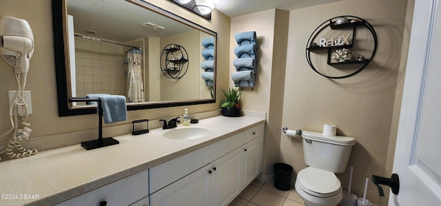 2700 N Atlantic Ave Unit 905, Daytona Beach, FL 32118 - full bathroom with tile patterned floors, vanity, toilet, and a shower with curtain