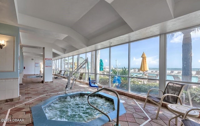 2700 N Atlantic Ave Unit 905, Daytona Beach, FL 32118 - sunroom / solarium with a jacuzzi and a water view