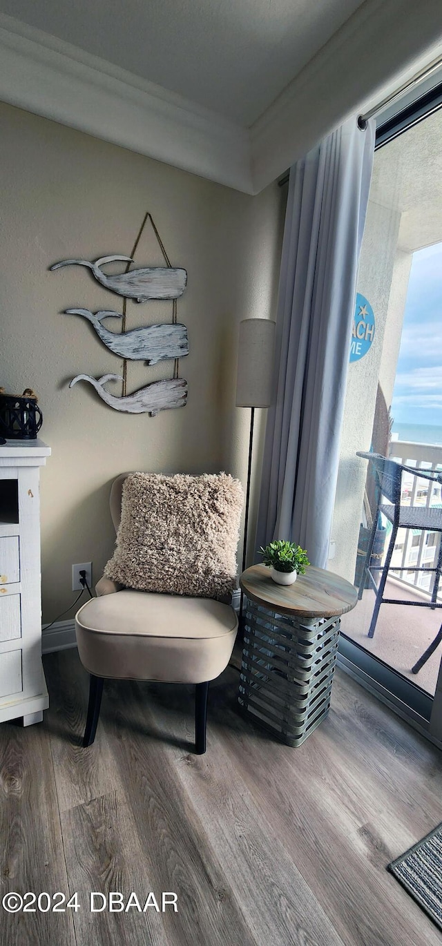 2700 N Atlantic Ave Unit 905, Daytona Beach, FL 32118 - living area featuring wood finished floors and crown molding
