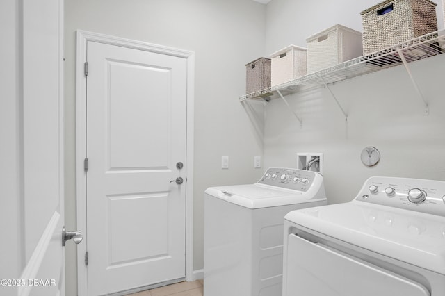 914 Attitude Ave, Daytona Beach, FL 32124 - laundry room with washing machine and dryer, light tile patterned flooring, and laundry area