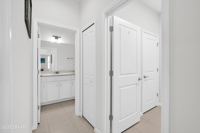 914 Attitude Ave, Daytona Beach, FL 32124 - hall with light tile patterned flooring and a sink