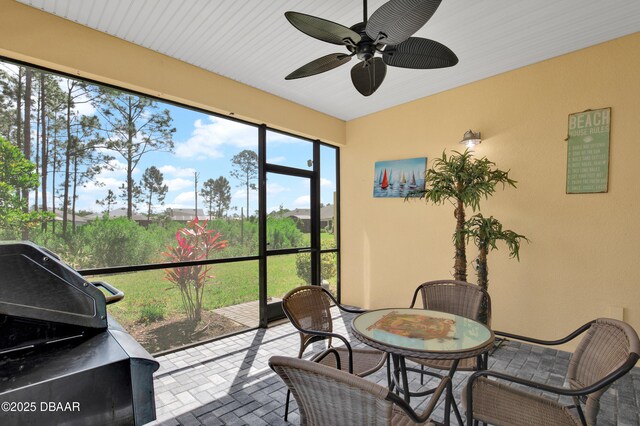 914 Attitude Ave, Daytona Beach, FL 32124 - sunroom featuring ceiling fan and outdoor dining space