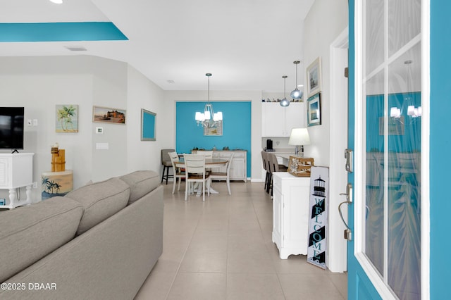 914 Attitude Ave, Daytona Beach, FL 32124 - living room featuring a chandelier, visible vents, and light tile patterned floors