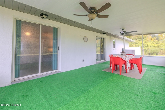 exterior space with ceiling fan