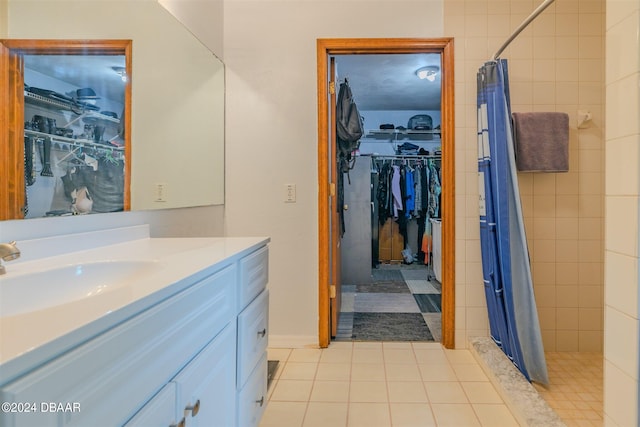 bathroom with vanity, a shower with shower curtain, and tile patterned flooring