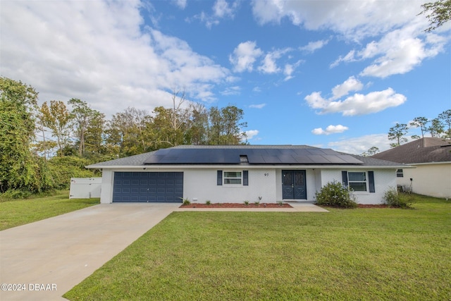 single story home featuring a front yard, solar panels, and a garage