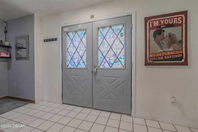 doorway featuring french doors and light tile patterned floors