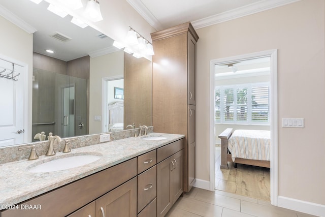 bathroom featuring ceiling fan, tile patterned flooring, a shower with door, vanity, and ornamental molding