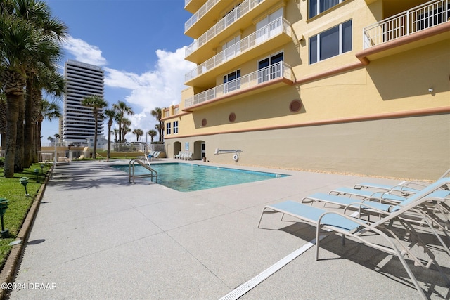 view of pool featuring a patio