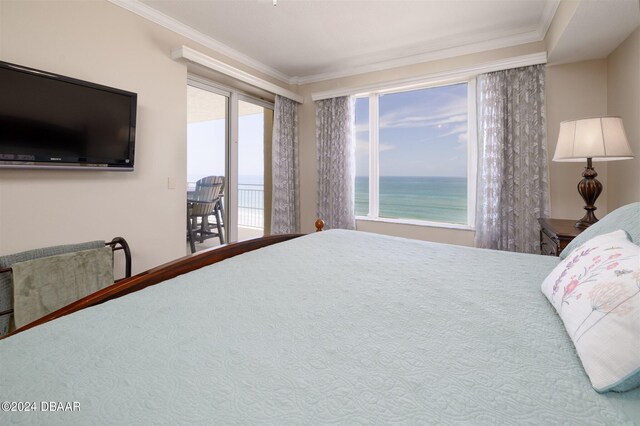 carpeted bedroom with access to exterior, a water view, and crown molding