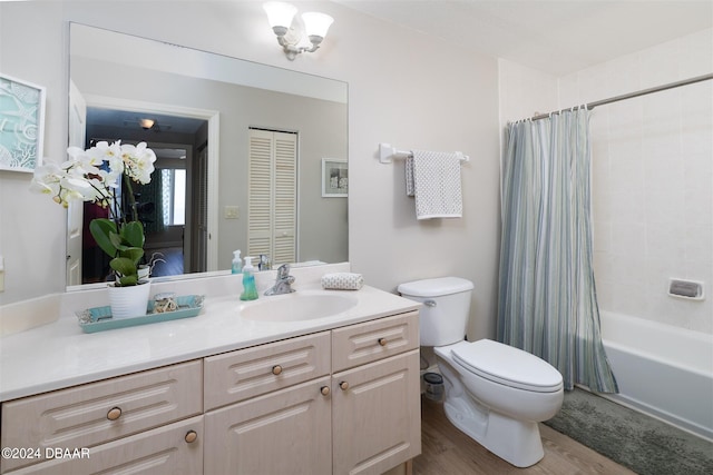 full bathroom with hardwood / wood-style floors, vanity, toilet, and shower / bathtub combination with curtain