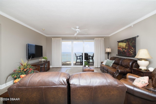 living room with ornamental molding, light wood-type flooring, and ceiling fan