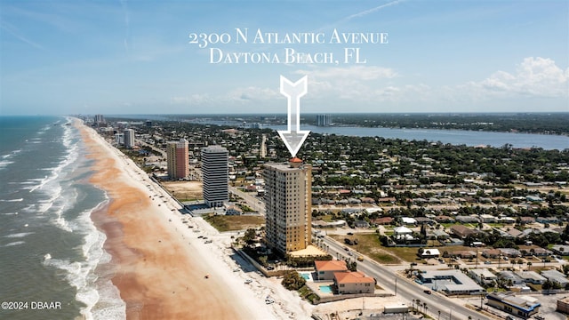 bird's eye view with a view of the beach and a water view